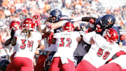 Oct 12, 2024; Charlottesville, Virginia, USA; Virginia Cavaliers quarterback Grady Brosterhous (19) scores a touchdown during the first half against the Louisville Cardinals at Scott Stadium. Mandatory Credit: Amber Searls-Imagn Images