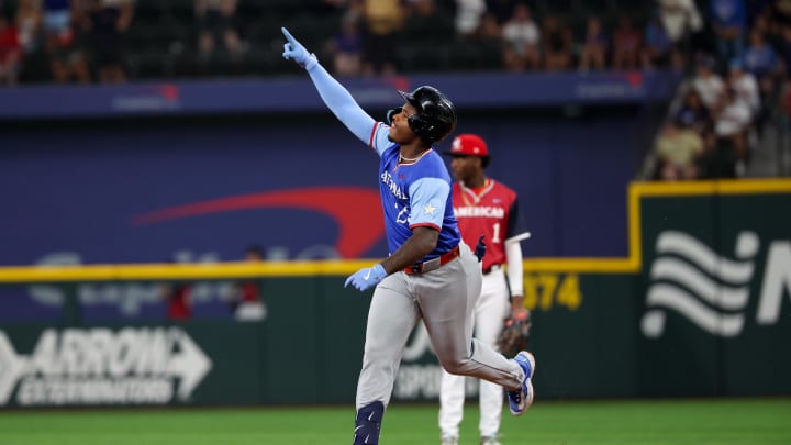 Jul 13, 2024; Arlington, TX, USA;  National League Future infielder Cam Collier (23) reacts after hitting a home run during the third inning against the National League Future team during the Major league All-Star Futures game at Globe Life Field.  Mandatory Credit: Kevin Jairaj-USA TODAY Sports