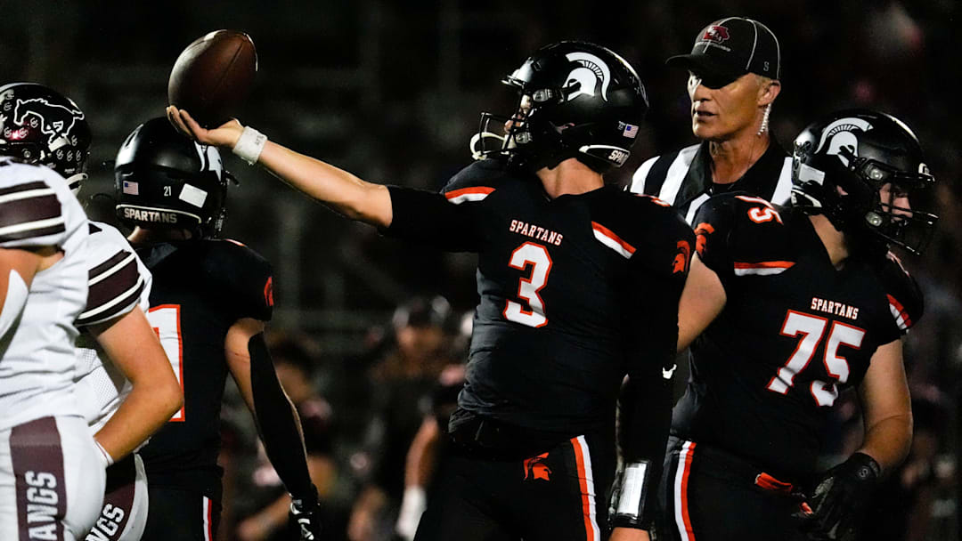 Solon’s Eli Kampman (3) holds up the ball after making a first down during a high school football game against Mount Vernon Sept. 12, 2025 in Solon, Iowa.