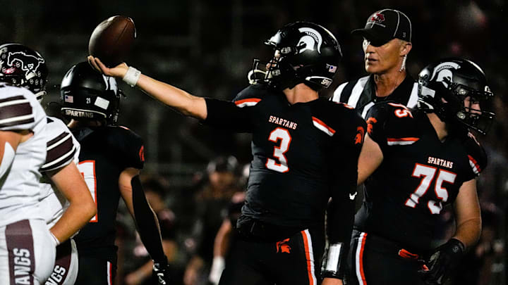 Solon’s Eli Kampman (3) holds up the ball after making a first down during a high school football game against Mount Vernon Sept. 12, 2025 in Solon, Iowa.