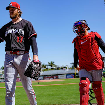 Pitcher Bailey Ober gestures to the crowd while walking to the dugout with catcher Christian Vazquez after a live batting practice session during the Minnesota Twins' first full-squad workout of spring training at the Lee Health Sports Complex in Fort Myers, Fla., on Monday, Feb. 17, 2025.