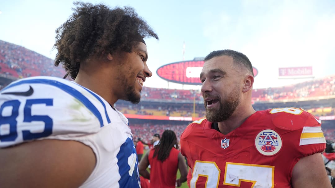 Nov 23, 2025; Kansas City, Missouri, USA;  Indianapolis Colts tight end Drew Ogletree (85) and Kansas City Chiefs tight end Travis Kelce (87) meet on field after the game at GEHA Field at Arrowhead Stadium. Mandatory Credit: Jay Biggerstaff-Imagn Images