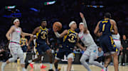Feb 28, 2025; Miami, Florida, USA; Indiana Pacers guard Andrew Nembhard (2) drives to the basket against Miami Heat guard Tyler Herro (14) during the second quarter at Kaseya Center. Mandatory Credit: Sam Navarro-Imagn Images