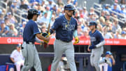 Jul 25, 2024; Toronto, Ontario, CAN; Tampa Bay Rays first baseman Isaac Paredes (17) leaves the batters box after drawing a bases loaded walk as shortstop Taylor Walls (8) comes in to score against the Toronto Blue Jays in the seventh inning at Rogers Centre. Mandatory Credit: Dan Hamilton-USA TODAY Sports