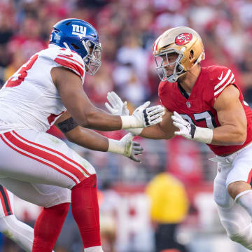 September 21, 2023; Santa Clara, California, USA; San Francisco 49ers defensive end Nick Bosa (97) rushes New York Giants offensive tackle Evan Neal (73) during the second quarter at Levi's Stadium.  