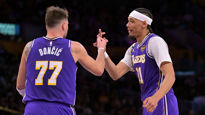 Dec 10, 2025; Los Angeles, California, USA;   Los Angeles Lakers guard Luka Doncic (77) and center Jaxson Hayes (11) on the court after a basket during the first half against the San Antonio Spurs at Crypto.com Arena. Mandatory Credit: Jayne Kamin-Oncea-Imagn Images