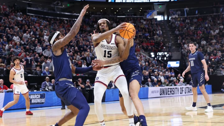Mar 21, 2024; Salt Lake City, UT, USA; Dayton Flyers forward Daron Holmes II (15) drives through Nevada Wolf Pack players during the second half in the first round of the 2024 NCAA Tournament at Vivint Smart Home Arena-Delta Center. Mandatory Credit: Rob Gray-USA TODAY Sports