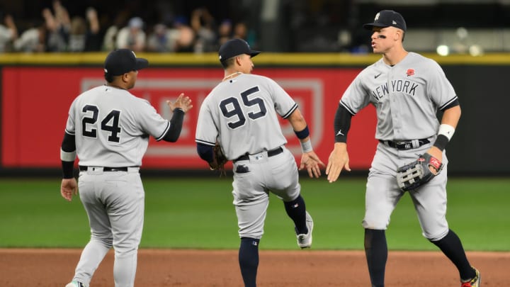 May 29, 2023; Seattle, Washington, USA; New York Yankees designated hitter Willie Calhoun (24) and third baseman Oswaldo Cabrera (95), and right fielder Aaron Judge (99) celebrate defeating the Seattle Mariners at T-Mobile Park. Mandatory Credit: Steven Bisig-USA TODAY Sports