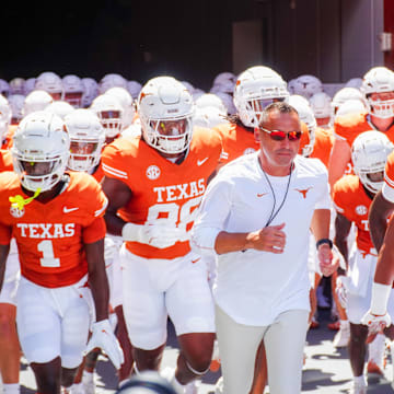 Aug 31, 2024; Austin, Texas, USA;  Texas Longhorns head coach Steve Sarkisian leads his team out onto the field at Darrell K Royal-Texas Memorial Stadium. Mandatory Credit: Aaron Meullion-Imagn Images