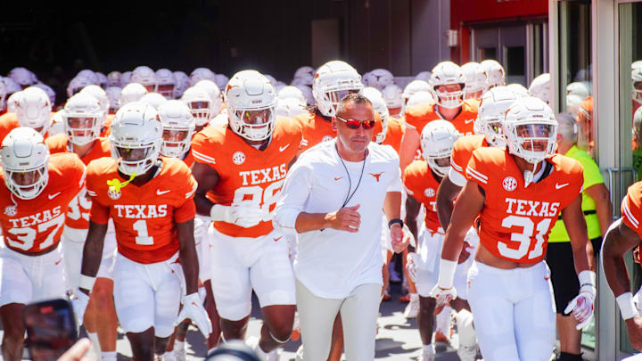 Aug 31, 2024; Austin, Texas, USA;  Texas Longhorns head coach Steve Sarkisian leads his team out onto the field at Darrell K Royal-Texas Memorial Stadium. Mandatory Credit: Aaron Meullion-Imagn Images