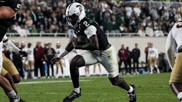 Sep 6, 2025; East Lansing, Michigan, USA; Michigan State quarterback Aidan Chiles (2) runs the ball into the end zone in double-overtime at Spartan Stadium. Mandatory Credit: Brendan Mullin-Imagn Images