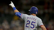 Texas Rangers infielder Dylan Moore (25) reacts after hitting a two-run home run against the Athletics during the ninth inning at Sutter Health Park. 