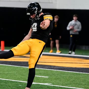 Iowa punter Rhys Dakin (9) punts during practices Thursday, April 3, 2025 in Iowa City, Iowa.