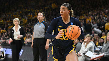 Mar 25, 2024; Iowa City, IA, USA;  West Virginia Mountaineers guard Kyah Watson (32) controls the ball against the Iowa Hawkeyes during the second quarter of the NCAA second round game at Carver-Hawkeye Arena. Mandatory Credit: Jeffrey Becker-Imagn Images
