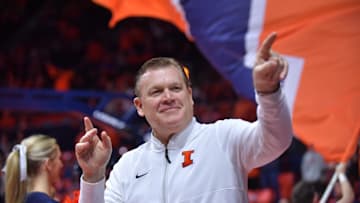 Dec 29, 2024; Champaign, Illinois, USA;  Illinois Fighting Illini head coach Brad Underwood acknowledges the fans before a game with the Chicago State Cougars at State Farm Center. Mandatory Credit: Ron Johnson-Imagn Images