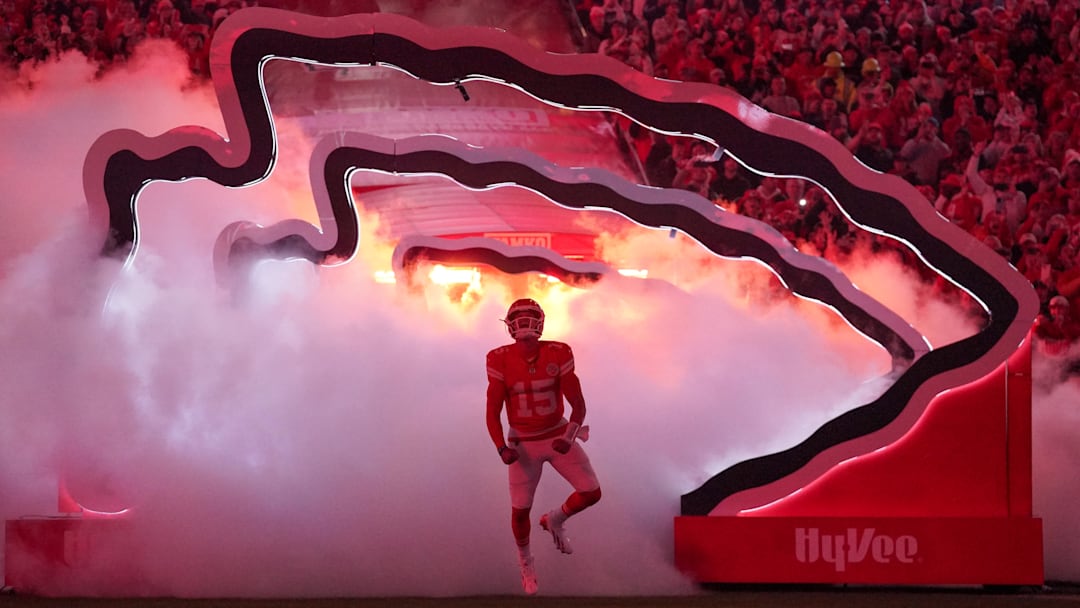 Oct 27, 2025; Kansas City, Missouri, USA; Kansas City Chiefs quarterback Patrick Mahomes (15) runs onto the field during player introductions prior to the game against the Washington Commanders at GEHA Field at Arrowhead Stadium. Mandatory Credit: Denny Medley-Imagn Images