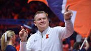 Dec 29, 2024; Champaign, Illinois, USA;  Illinois Fighting Illini head coach Brad Underwood acknowledges the fans before a game with the Chicago State Cougars at State Farm Center. Mandatory Credit: Ron Johnson-Imagn Images
