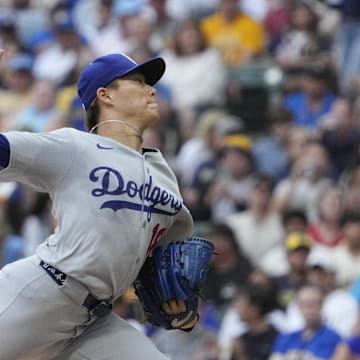 Jul 7, 2025; Milwaukee, Wisconsin, USA; Los Angeles Dodgers pitcher Yoshinobu Yamamoto (18) delivers a pitch against the Milwaukee Brewers in the first inning at American Family Field. Mandatory Credit: Michael McLoone-Imagn Image