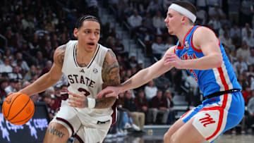 Jan 18, 2025; Starkville, Mississippi, USA; Mississippi State Bulldogs guard Riley Kugel (2) drives to the basket as Mississippi Rebels guard Sean Pedulla (3) defends during the second half at Humphrey Coliseum. Mandatory Credit: Petre Thomas-Imagn Images