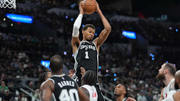 Oct 27, 2025; San Antonio, Texas, USA;  San Antonio Spurs forward/center Victor Wembanyama (1) rebounds in the first half against the Toronto Raptors at Frost Bank Center. Mandatory Credit: Daniel Dunn-Imagn Images