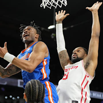 Apr 7, 2025; San Antonio, TX, USA; Florida Gators guard Alijah Martin (15) shoots the ball against Houston Cougars forward J'Wan Roberts (13) during the second half of the national championship game of the Final Four of the 2025 NCAA Tournament at the Alamodome. Mandatory Credit: Bob Donnan-Imagn Images