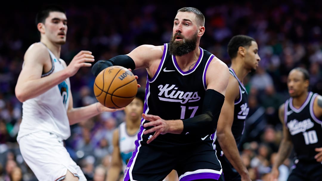 Mar 17, 2025; Sacramento, California, USA; Sacramento Kings center Jonas Valanciunas (17) passes the ball against Memphis Grizzlies center Zach Edey (14) during the fourth quarter at Golden 1 Center. Mandatory Credit: Sergio Estrada-Imagn Images