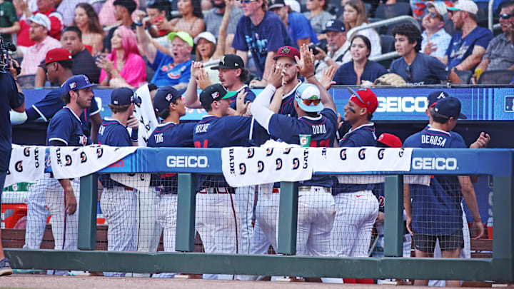 The National League team celebrates after their win against the American League during the MLB All-Star Game at Truist Park