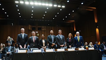 NCAA President Charlie Baker, left, Tony Petitti, Commissioner, Big Ten Conference, second from left, Trinity Thomas, gymnast, University of Florida, third from left, Ramogi Huma, Executive Director, National College Players Association, center, Walker Jones, Executive Director, The Grove Collective, third from right, Jill Bodensteiner, Vice President and Director of Athletics, Saint Joseph's University, second from right and Jack Swarbrick, Vice President on Oct 17, 2023.