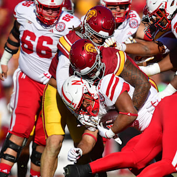Nebraska Cornhuskers running back Dante Dowdell is brought down by the Southern California Trojans' defense.