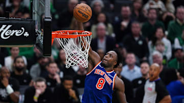 New York Knicks forward OG Anunoby (8) drives to the basket against the Boston Celtics in the fourth quarter during game one of the second round for the 2025 NBA Playoffs at TD Garden.