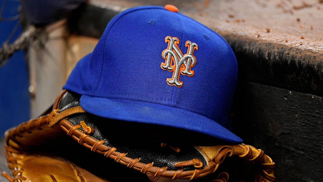 Jul 13, 2019; Miami, FL, USA; A general view of a New York Mets hat and glove on the steps of the dugout in the game between the Miami Marlins and the New York Mets at Marlins Park. Mandatory Credit: Jasen Vinlove-Imagn Images