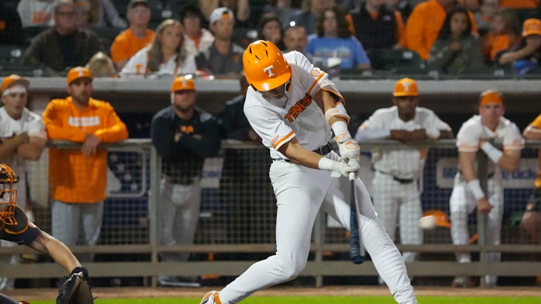 Tennessee's Dean Curley (1) hits the ball during the Tennessee Orange & White scrimmage baseball game at the Smokies Stadium in Kodak, Tenn., on Friday, November 8, 2024.