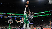 Apr 5, 2024; Boston, Massachusetts, USA; Boston Celtics guard Jrue Holiday (4) shoots the ball over Sacramento Kings guard Keon Ellis (23) during the first half at TD Garden. Mandatory Credit: Eric Canha-Imagn Images