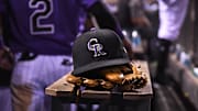 Aug 4, 2017; Denver, CO, USA; General view of the hat and glove of Colorado Rockies shortstop Pat Valaika (4) (not pictured) in the seventh inning against the Philadelphia Phillies at Coors Field.