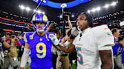 Nov 11, 2024; Inglewood, California, USA; Los Angeles Rams quarterback Matthew Stafford (9) meets with Miami Dolphins cornerback Jalen Ramsey (5) following the game at SoFi Stadium. Mandatory Credit: Gary A. Vasquez-Imagn Images