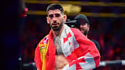 Feb 17, 2024; Anaheim, California, USA; Ilia Topuria celebrates his championship victory against Alexander Volkanovski during UFC 298 at Honda Center. Mandatory Credit: Gary A. Vasquez-Imagn Images
