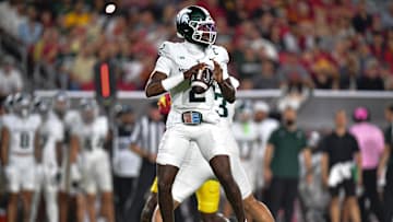 Sep 20, 2025; Los Angeles, California, USA; Michigan State Spartans quarterback Aidan Chiles (2) drops back to pass against the Southern California Trojans during the first half at the Los Angeles Memorial Coliseum. Mandatory Credit: Gary A. Vasquez-Imagn Images