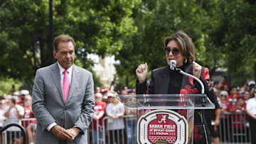 Sep 7, 2024; Tuscaloosa, Alabama, USA;  Former Alabama head coach Nick Saban listens as his wife Terry Saban speaks as the University of Alabama renames the field in his honor at Bryant-Denny Stadium. The new name is Saban Field at Bryant-Denny Stadium. Mandatory Credit: Gary Cosby Jr.-Imagn Images