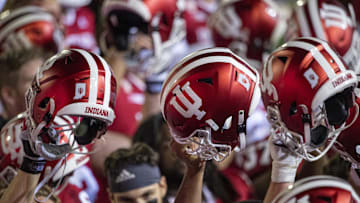 Oct 24, 2020; Bloomington, Indiana, USA;  Indiana Hoosiers raise their helmets after the game at Memorial Stadium. The Indiana Hoosiers defeated the Penn State Nittany Lions 36 to 35.  Mandatory Credit: Marc Lebryk-Imagn Images