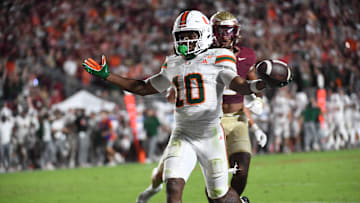 Oct 4, 2025; Tallahassee, Florida, USA; Miami Hurricanes wide receiver Malachi Toney (10) scores a touchdown during the second half against the Florida State Seminoles at Doak S. Campbell Stadium. Mandatory Credit: Robert Myers-Imagn Images