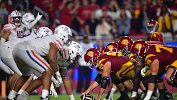Oct 7, 2023; Los Angeles, California, USA; Southern California Trojans offensive lineman Justin Dedich (57) lines up against the Arizona Wildcats defense during the second half at Los Angeles Memorial Coliseum. Mandatory Credit: Gary A. Vasquez-USA TODAY Sports