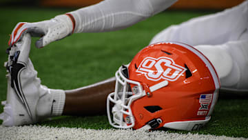 Dec 4, 2021; Arlington, TX, USA; A view of an Oklahoma State Cowboys helmet and logo as the Cowboys warm up before the game against the Baylor Bears during the Big 12 Conference championship game at AT&T Stadium. Mandatory Credit: Jerome Miron-Imagn Images