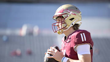 Nov 23, 2024; Tallahassee, Florida, USA; Florida State Seminoles quarterback Brock Glenn (11) warms up before the game against the Charleston Southern Buccaneers at Doak S. Campbell Stadium. Mandatory Credit: Melina Myers-Imagn Images