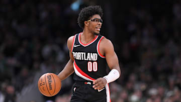 Apr 7, 2024; Boston, Massachusetts, USA; Portland Trail Blazers guard Scoot Henderson (00) moves the ball against the Boston Celtics during the first half at TD Garden. Mandatory Credit: Eric Canha-Imagn Images