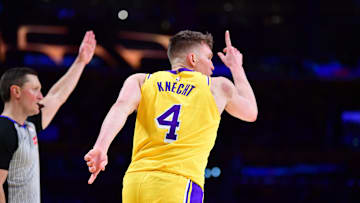Mar 6, 2025; Los Angeles, California, USA; Los Angeles Lakers guard Dalton Knecht (4) reacts after scoring a three point basket against the New York Knicks during the second half at Crypto.com Arena. Mandatory Credit: Gary A. Vasquez-Imagn Images
