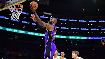 Nov 19, 2024; Los Angeles, California, USA;  Los Angeles Lakers forward LeBron James (23) scores a basket against the against the Utah Jazz during the first half at Crypto.com Arena. Mandatory Credit: Gary A. Vasquez-Imagn Images