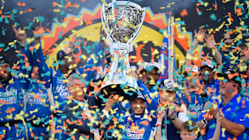 Nov 2, 2025; Avondale, Arizona, USA; NASCAR Cup Series driver Kyle Larson (5) celebrates his championship victory following the Cup Series Championship race at Phoenix Raceway.