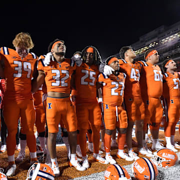 Sep 7, 2024; Champaign, Illinois, USA; Illinois Fighting Illini players celebrate their win over the Kansas Jayhawks  at Memorial Stadium. Mandatory Credit: Ron Johnson-Imagn Images