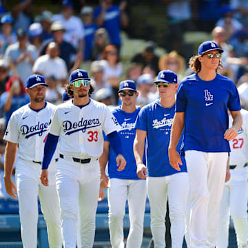 Jul 25, 2024; Los Angeles, California, USA; Los Angeles Dodgers pitcher Blake Treinen (49) outfielder James Outman (33) pitcher Gavin Stone (35) pitcher River Ryan (70) pitcher Tyler Glasnow (31) catcher Will Smith (16) and designated hitter Shohei Ohtani (17) celebrate the victory against the San Francisco Giants at Dodger Stadium. Mandatory Credit: Gary A. Vasquez-Imagn Images