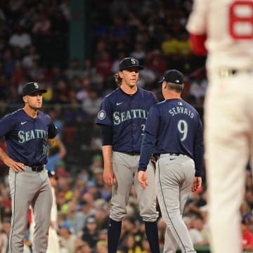 Seattle Mariners manager Scott Servais (9) relives starting pitcher Logan Gilbert (36) of the ball during the third inning against the Boston Red Sox at Fenway Park on July 29.